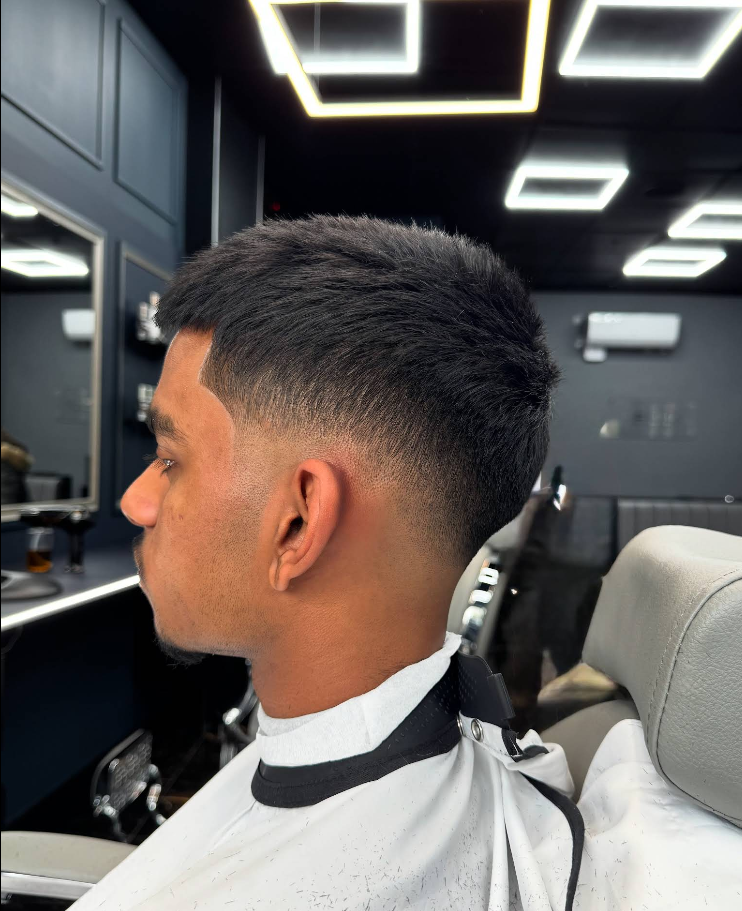 Clean skin fade result at Homme Barbers