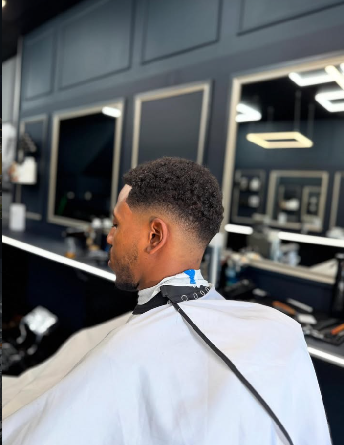 Curly taper fade at Homme Barbers