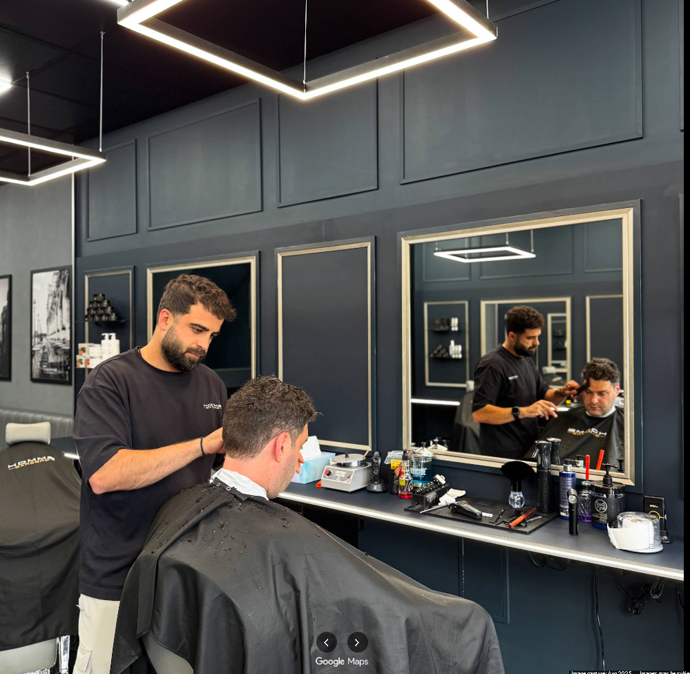 Curly taper fade at Homme Barbers